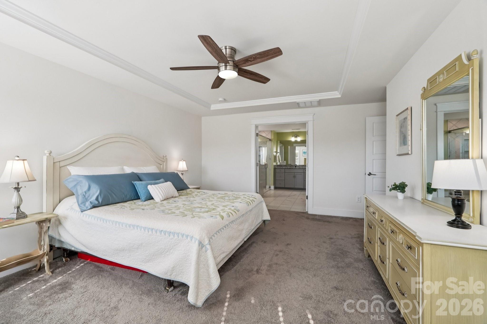 4093 Clapton Drive Lancaster, SC 29720 - Photo 24 of 48 a bedroom with a large bed and a chandelier
