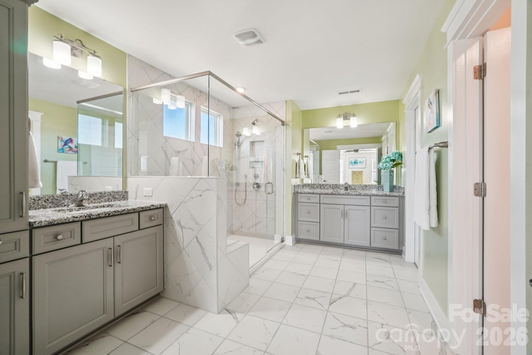 4093 Clapton Drive Lancaster, SC 29720 - Photo 25 of 48 a bathroom with a granite countertop sink a mirror and a shower