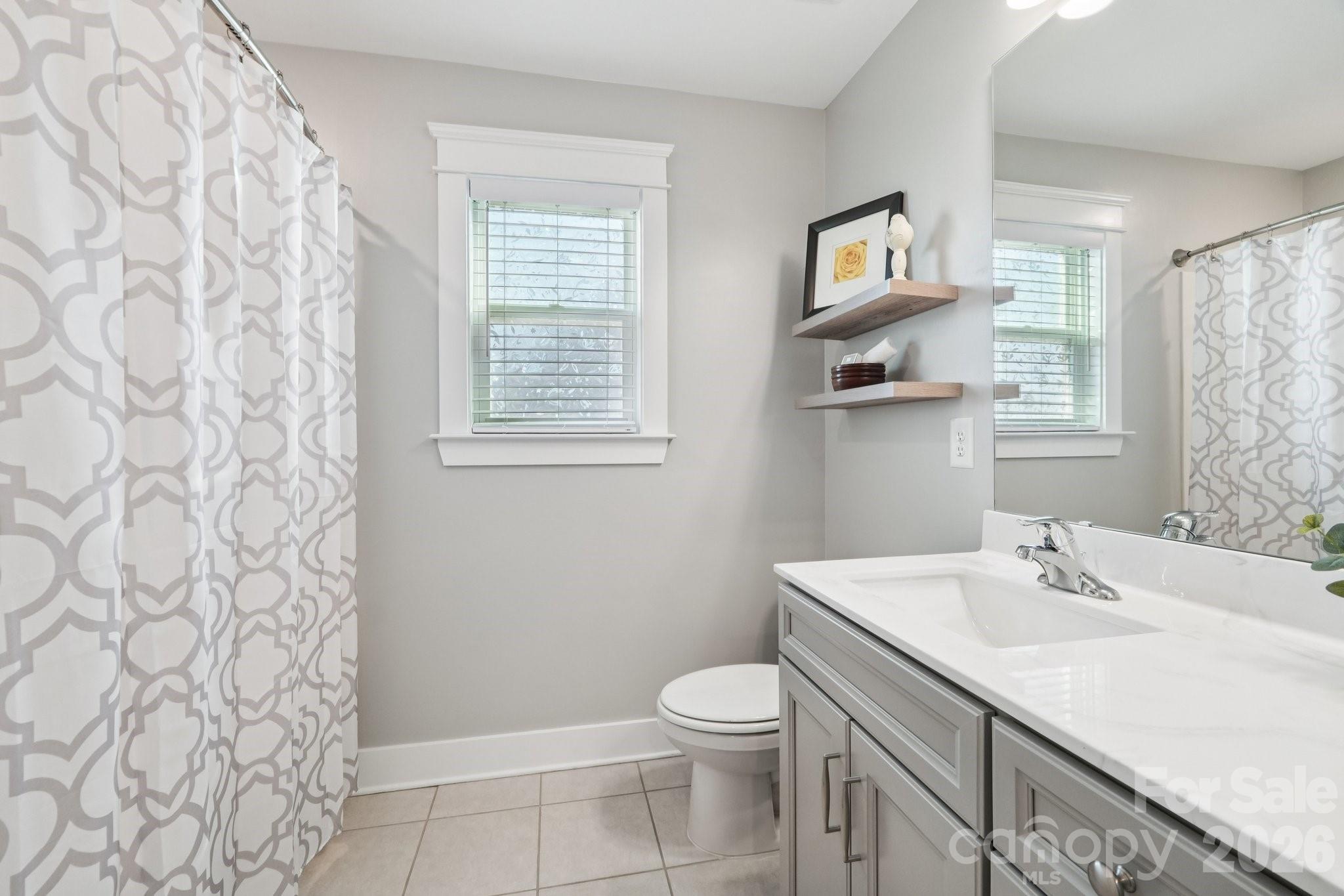 4093 Clapton Drive Lancaster, SC 29720 - Photo 29 of 48 a bathroom with a sink toilet and vanity