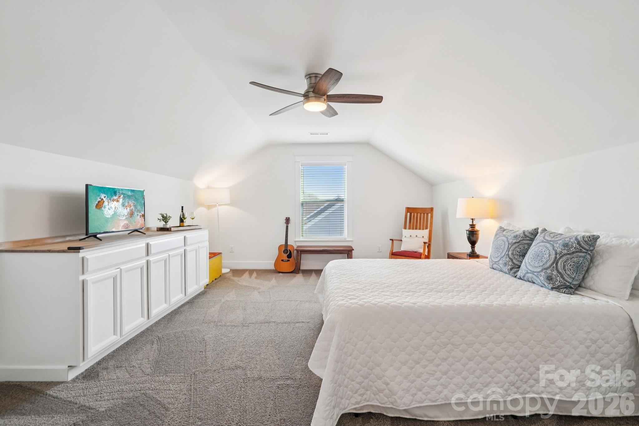 4093 Clapton Drive Lancaster, SC 29720 - Photo 34 of 48 a bedroom with a bed and a chandelier