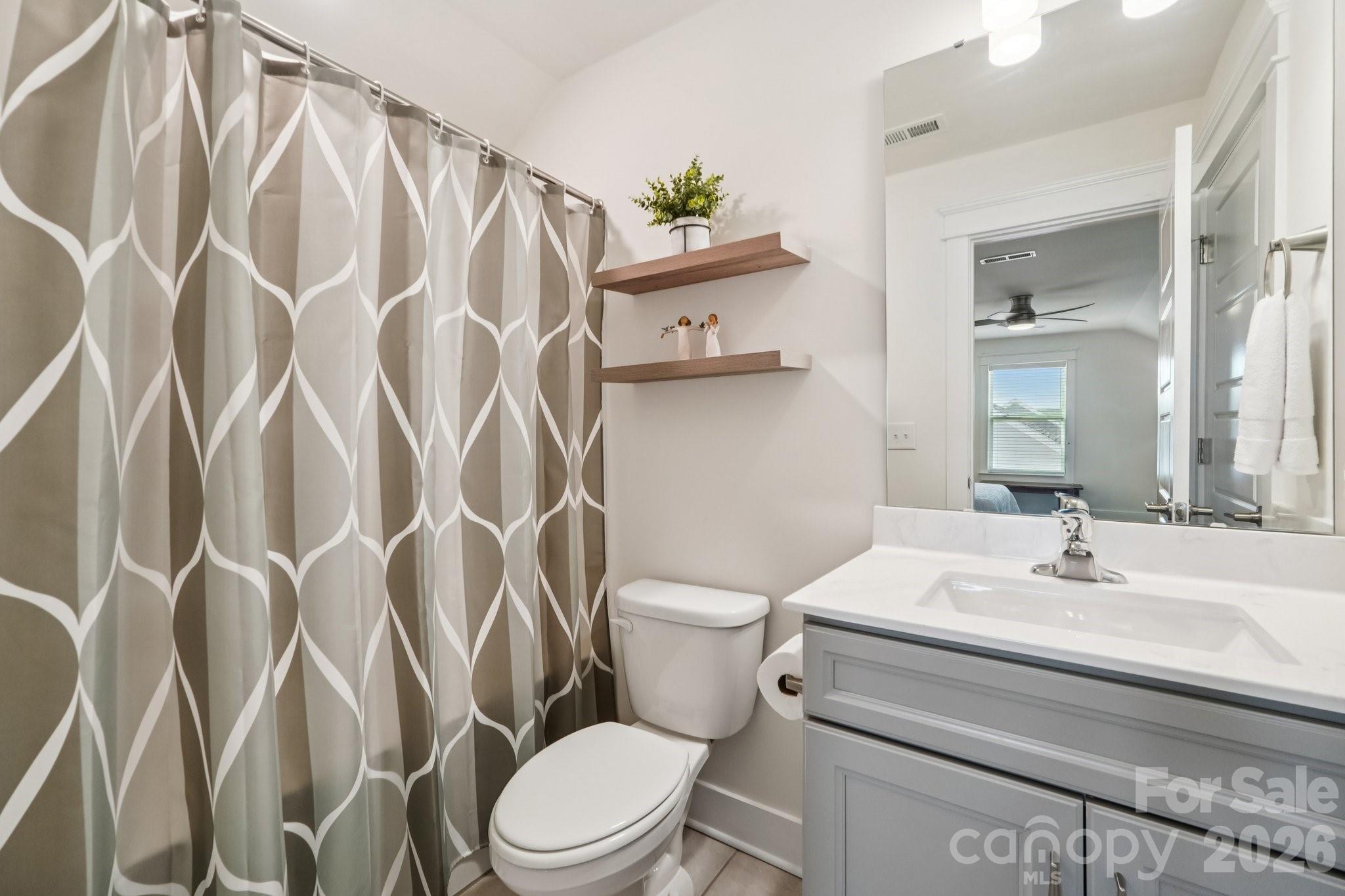 4093 Clapton Drive Lancaster, SC 29720 - Photo 36 of 48 a white toilet sitting next to a bathroom sink
