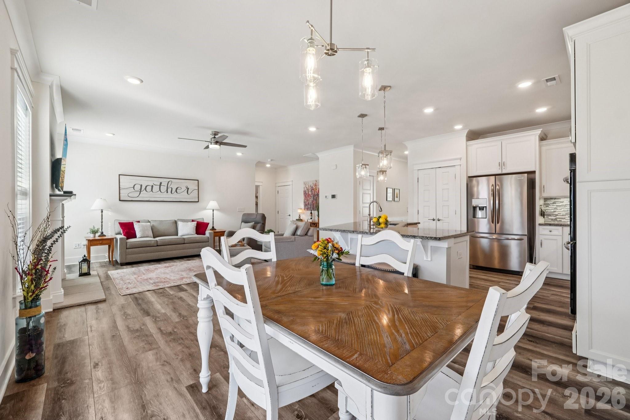 4093 Clapton Drive Lancaster, SC 29720 - Photo 10 of 48 a living room with stainless steel appliances furniture a dining table and chairs
