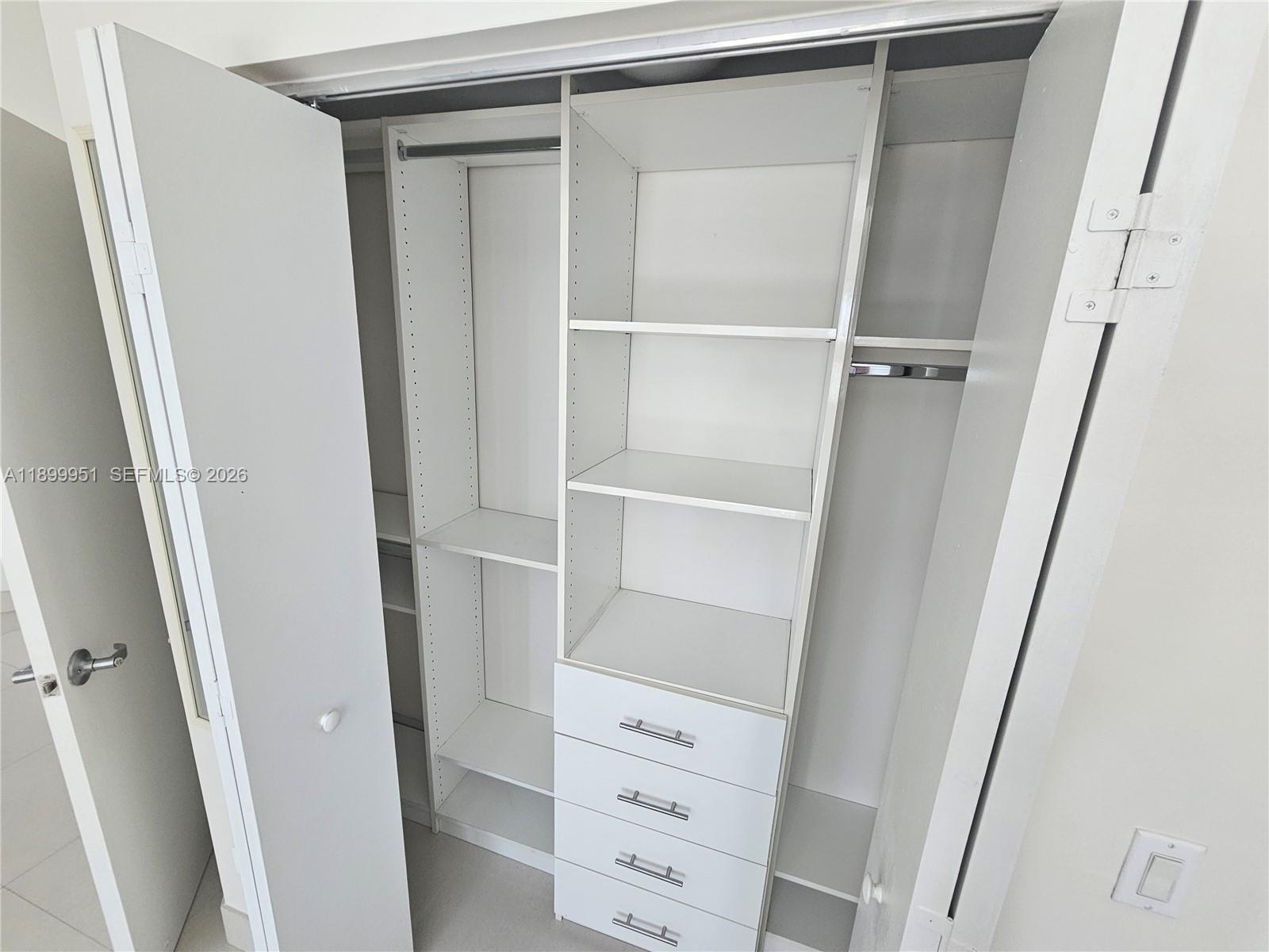 60 Southwest 13th Street, Unit 1900 Miami, FL 33130 - Photo 38 of 96 a view of walk in closet with empty racks