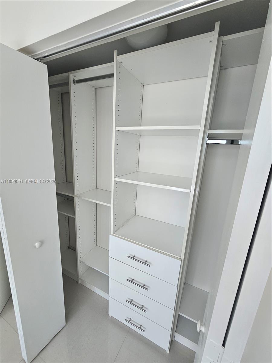 60 Southwest 13th Street, Unit 1900 Miami, FL 33130 - Photo 41 of 96 a view of walk in closet with empty racks