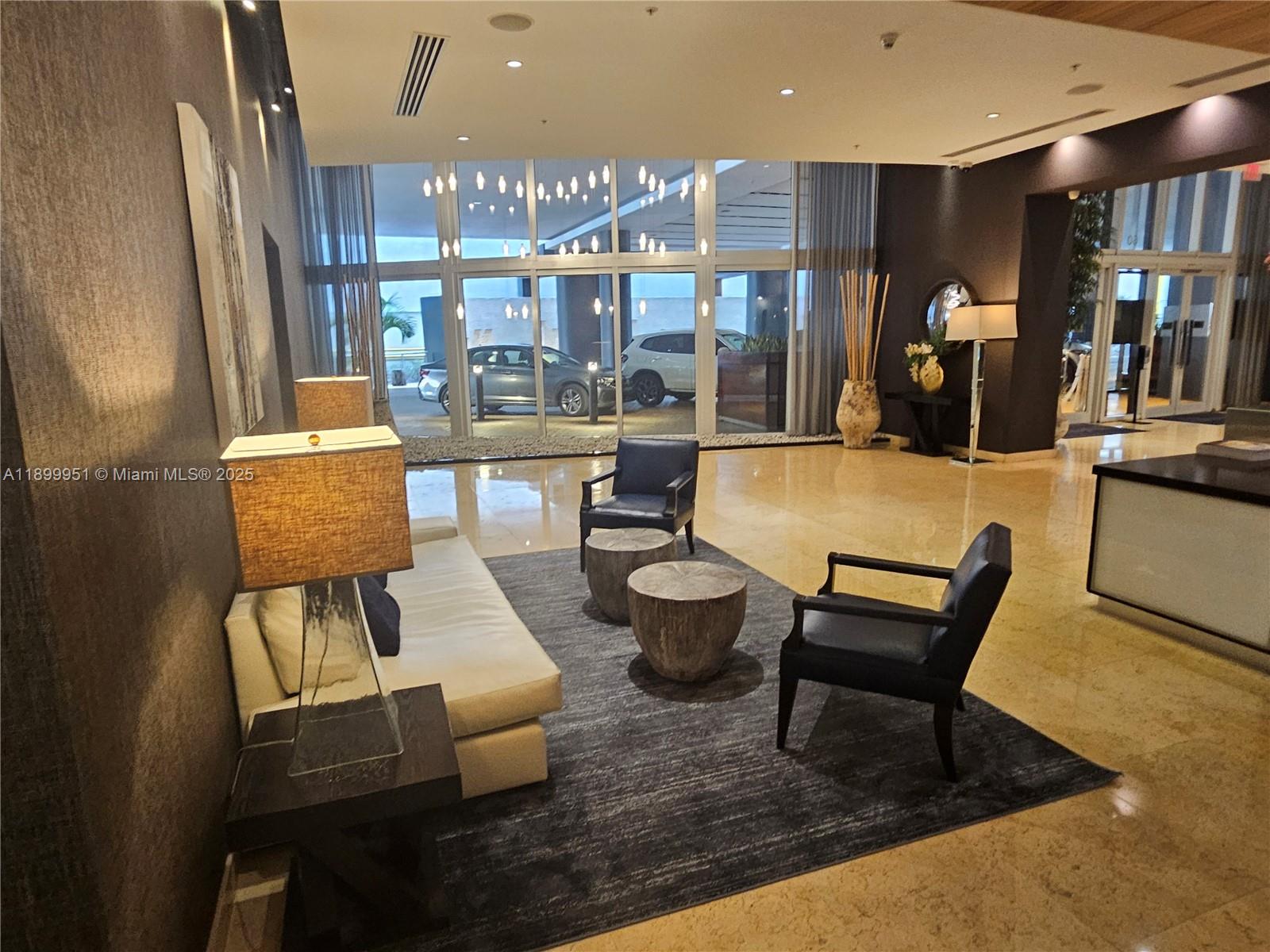 60 Southwest 13th Street, Unit 1900 Miami, FL 33130 - Photo 79 of 95 a living room with furniture and a table