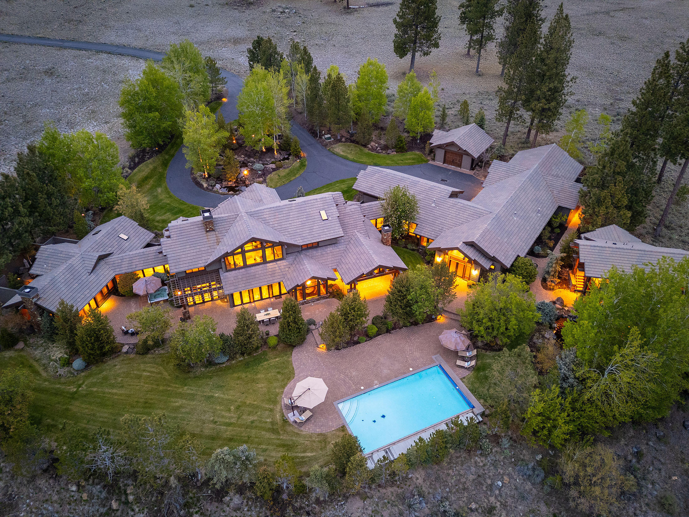 18883 Sutherland Court Bend, OR 97702 - Photo 2 of 70 An elevated view of pure serenity?10.9 private acres with resort-style pool, guest house, and sweeping mountain scenery in the exclusive Highlands at Broken Top.