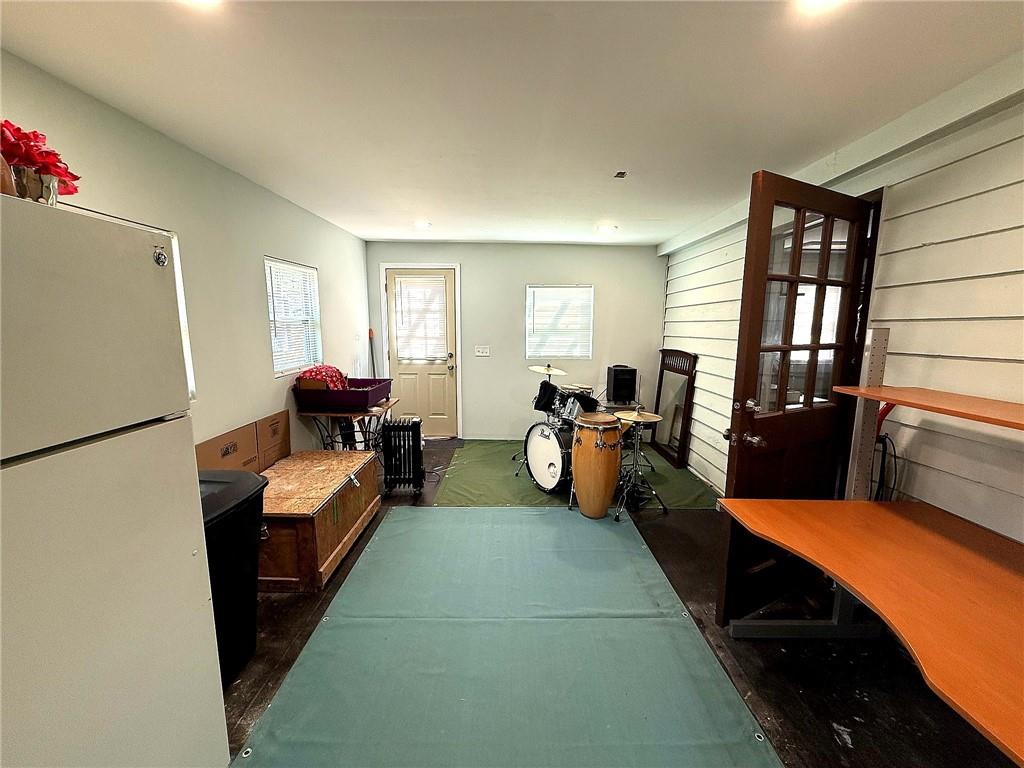 1125 Pecks Road Dahlonega, GA 30533 - Photo 22 of 35 a bed room with furniture and a refrigerator