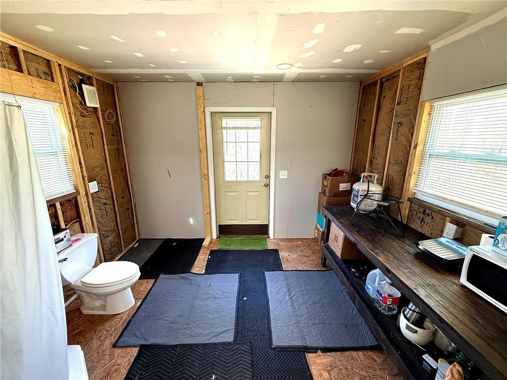 1125 Pecks Road Dahlonega, GA 30533 - Photo 23 of 35 a very nice looking room with many windows and furniture