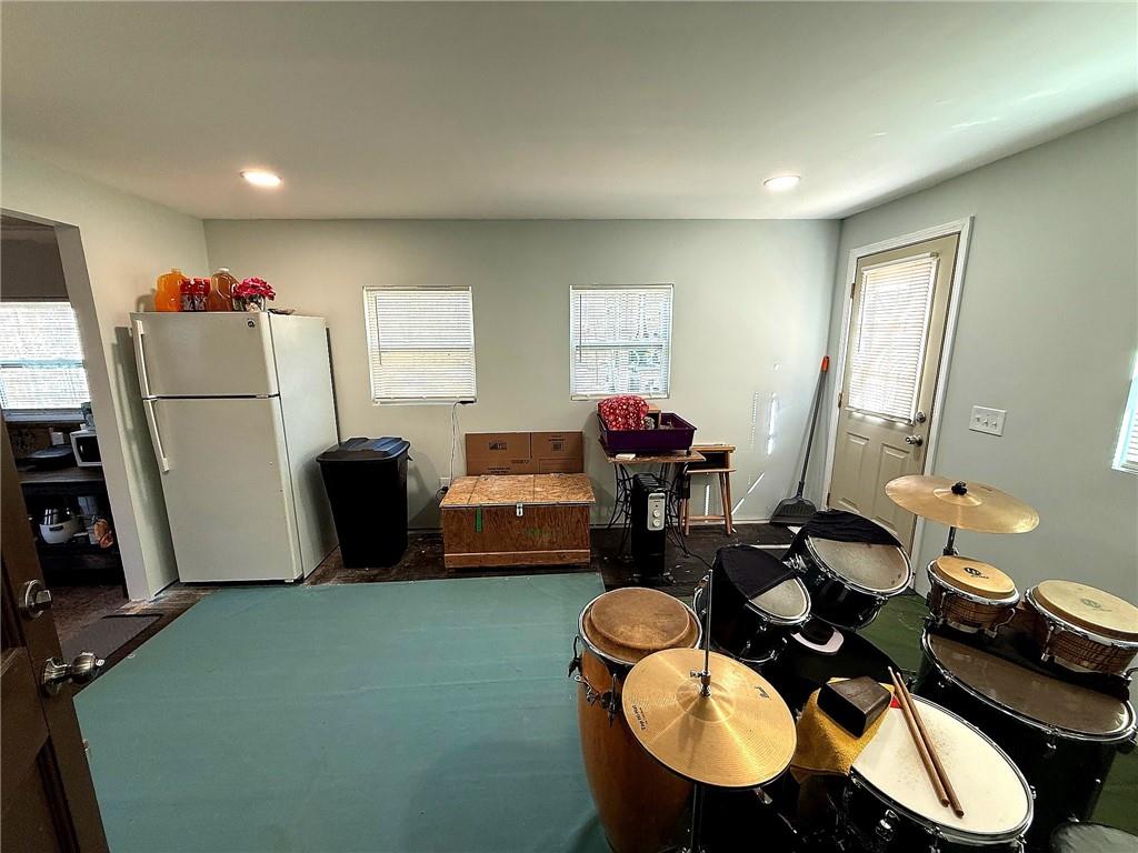 1125 Pecks Road Dahlonega, GA 30533 - Photo 28 of 35 a living room with furniture a rug and a window