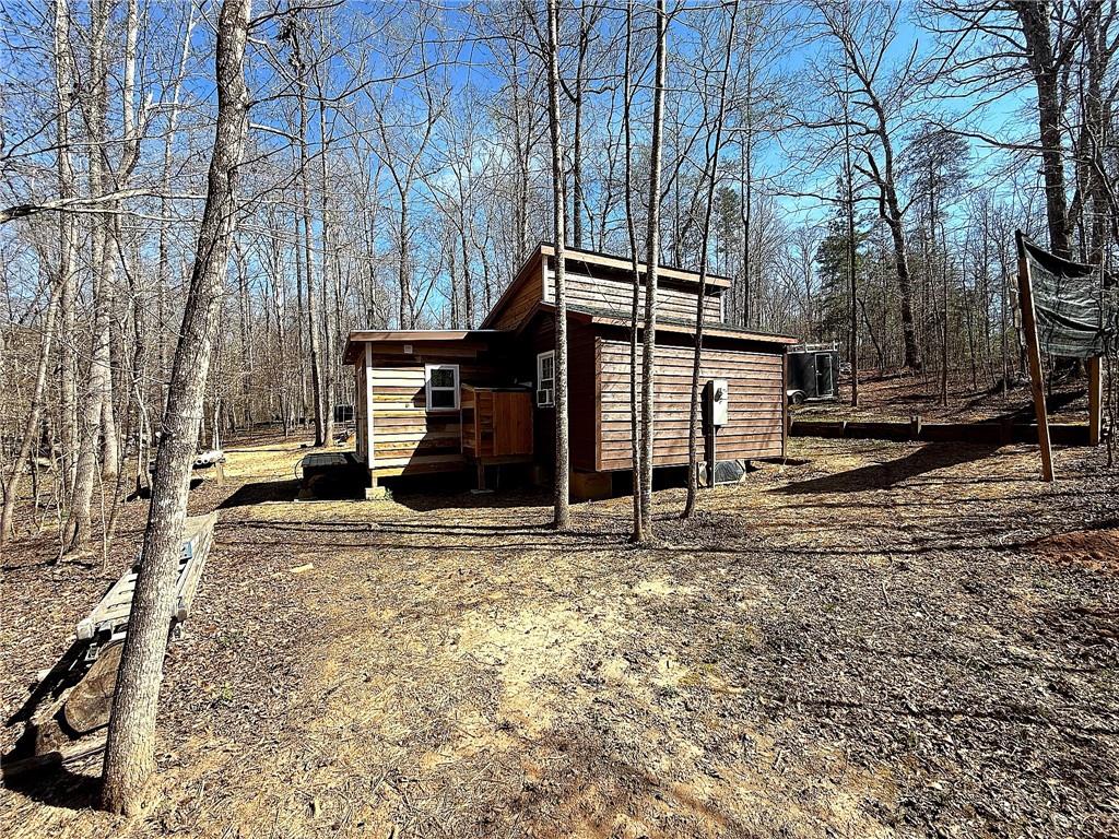 1125 Pecks Road Dahlonega, GA 30533 - Photo 32 of 35 a view of a house with a snow on the side of the road