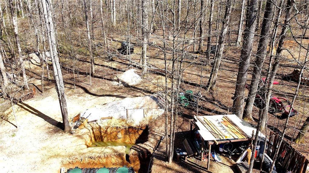 1125 Pecks Road Dahlonega, GA 30533 - Photo 7 of 35 a view of a chairs and table in the backyard