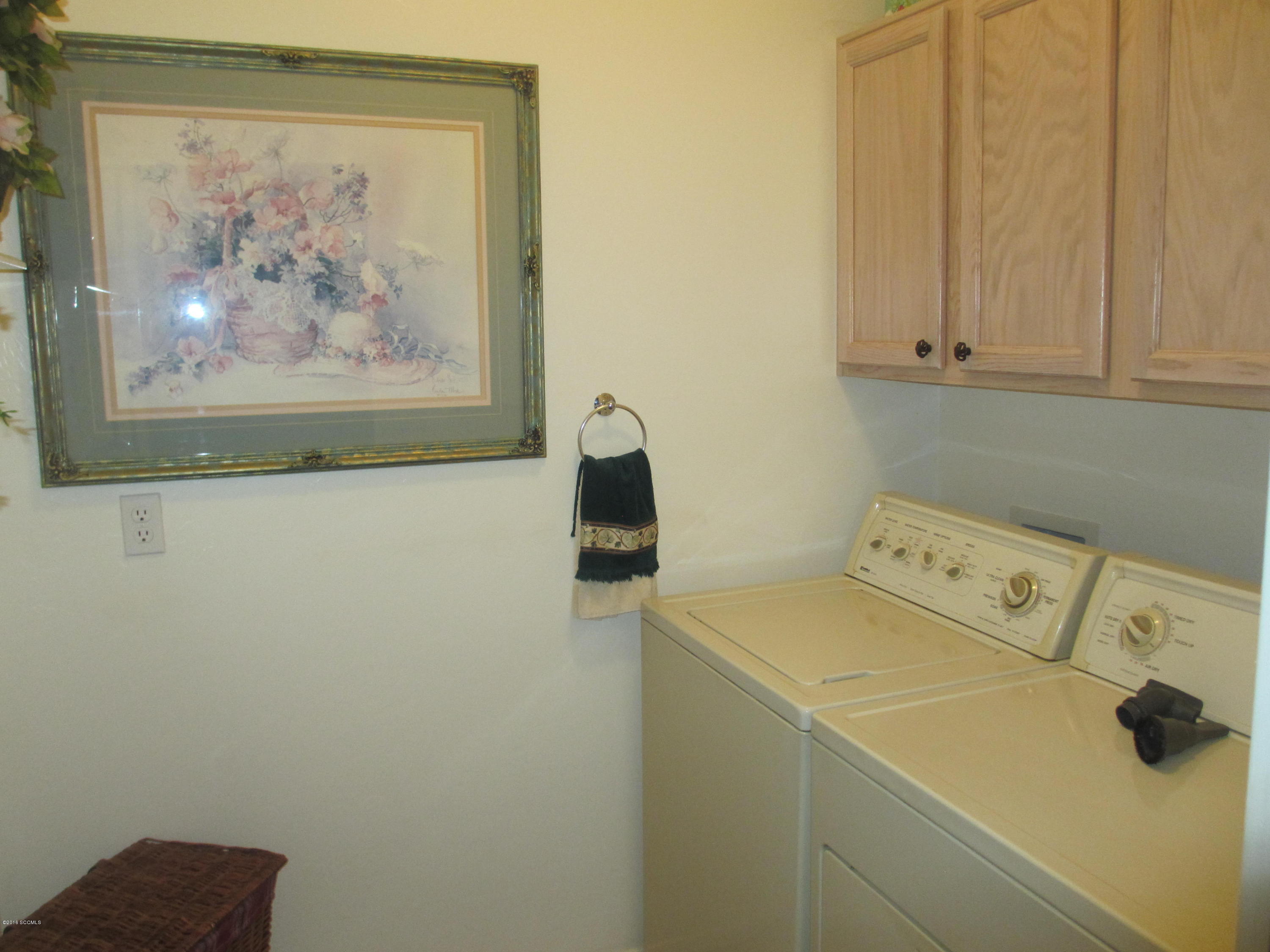 353 Via Bella Donna Rio Rico, AZ 85648 - Photo 23 of 44 a utility room with dryer and washer