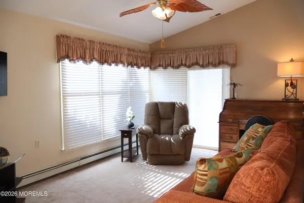 a living room with furniture and a window