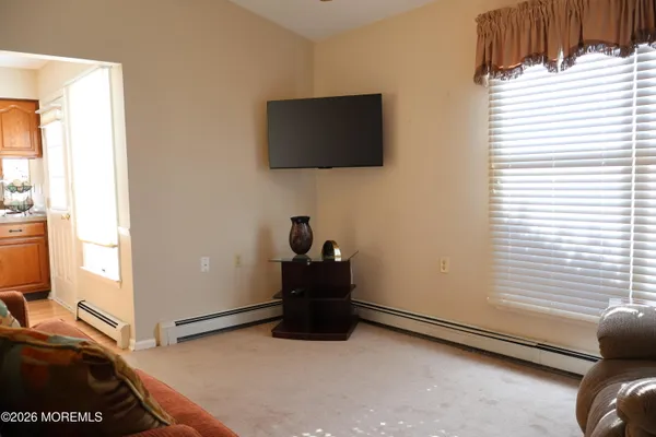 a room with a bed and a flat screen tv