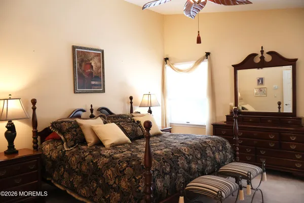 a bedroom with bed and a dresser