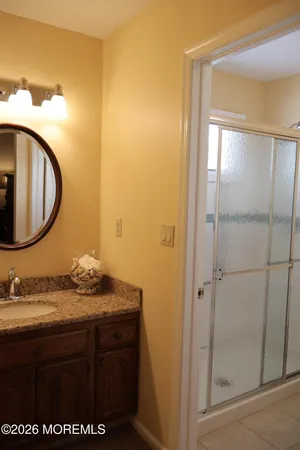 a bathroom with a sink and a mirror