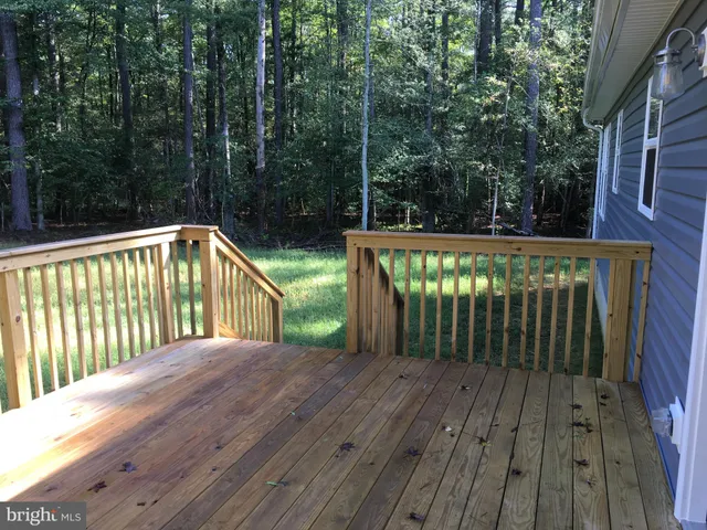 a balcony with trees in front of it