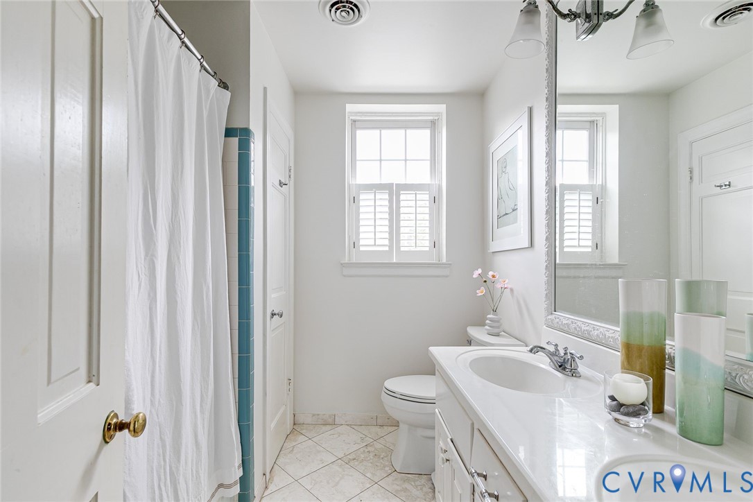 7706 Stuart Hall Road Henrico, VA 23229 - Photo 29 of 50 Double vanity sinks, tiles, window
