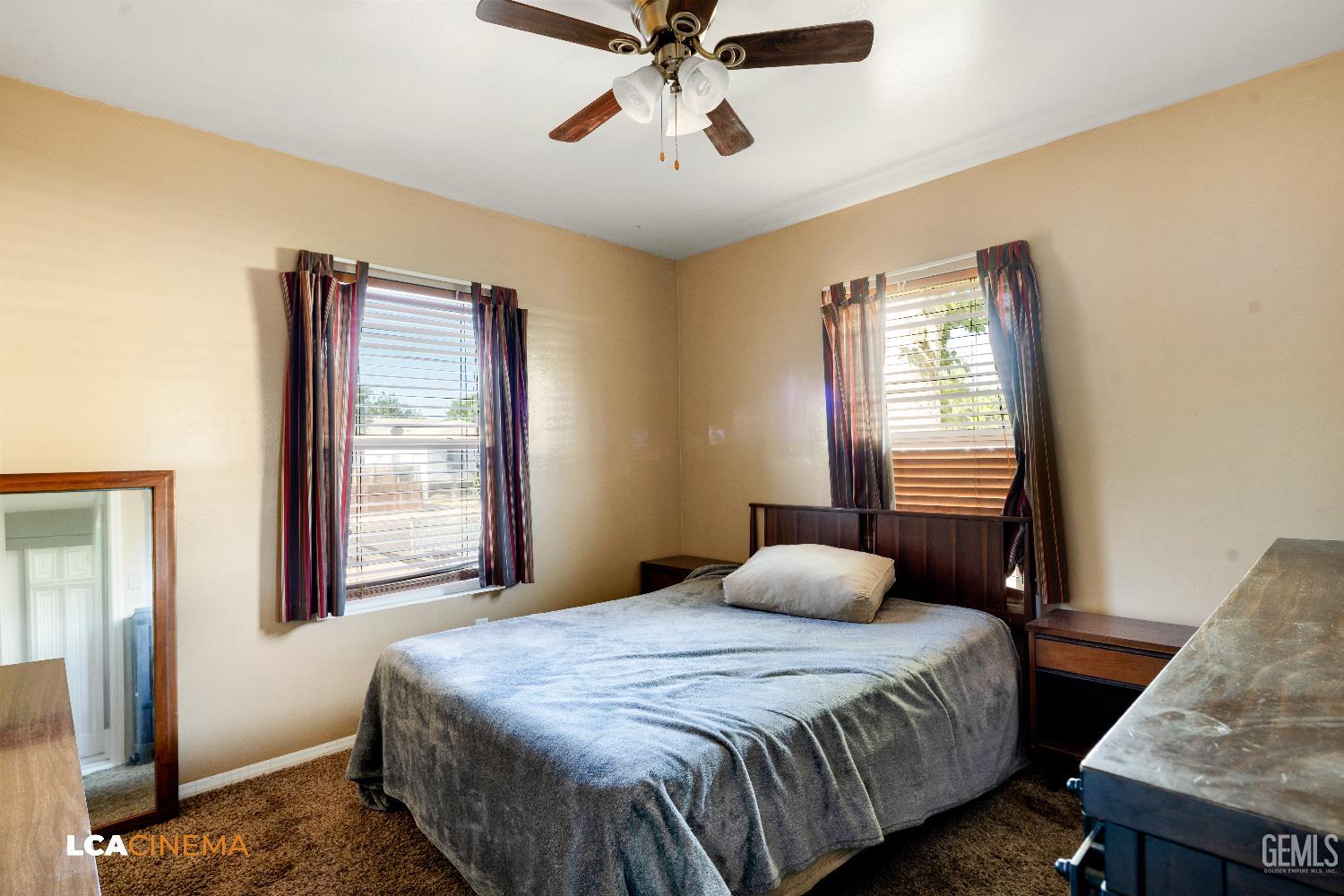 Undisclosed Address Bakersfield, CA 93308 - Photo 12 of 19 a bedroom with a bed and a window