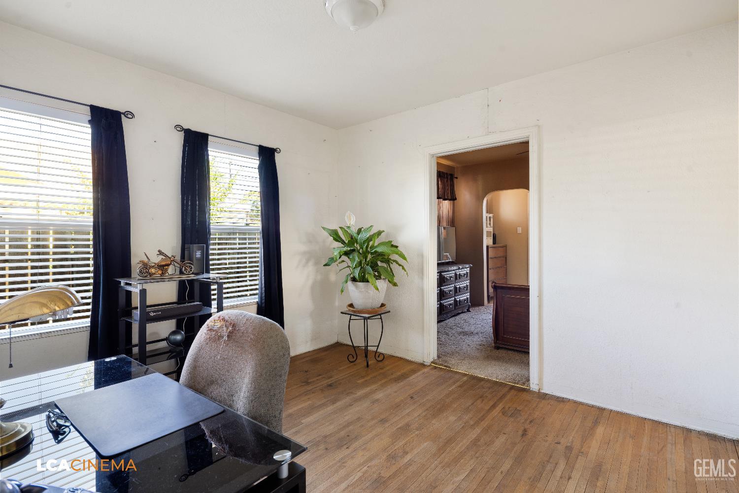 Undisclosed Address Bakersfield, CA 93308 - Photo 16 of 19 a view of a livingroom with furniture and a potted plant