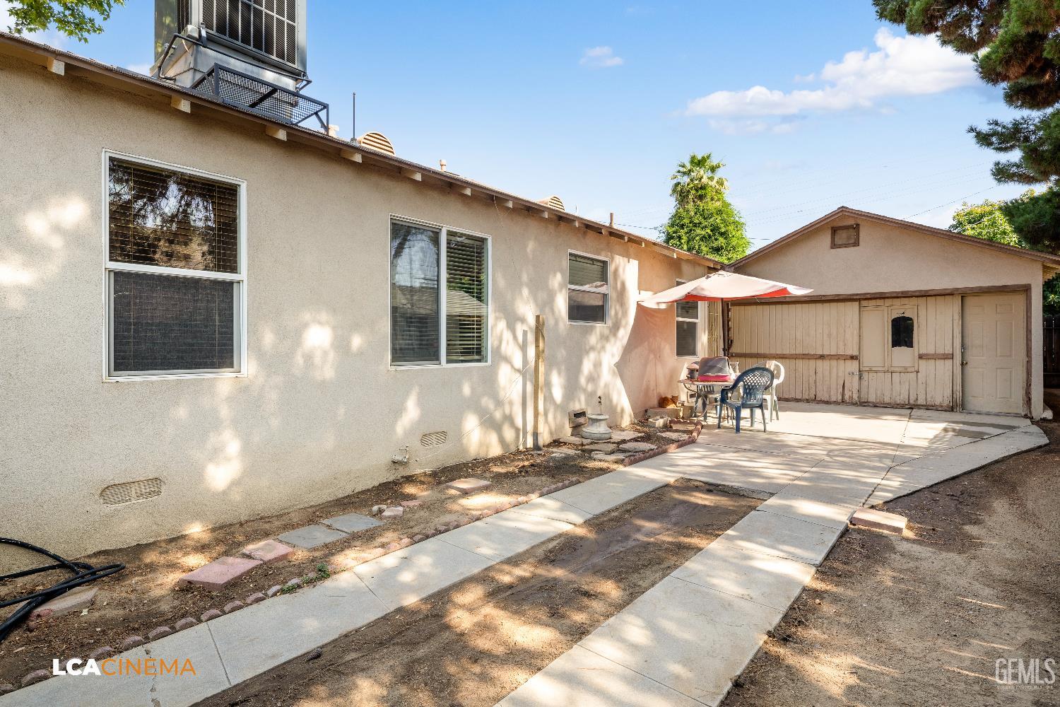 Undisclosed Address Bakersfield, CA 93308 - Photo 17 of 19 a front view of a house with a patio