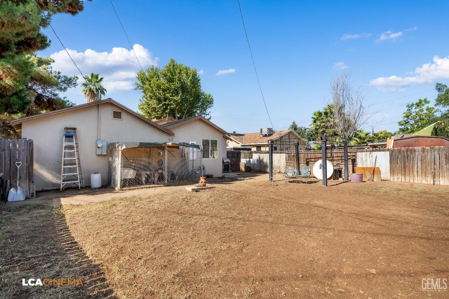 Undisclosed Address Bakersfield, CA 93308 - Photo 19 of 19 a front view of a house with a yard and garage