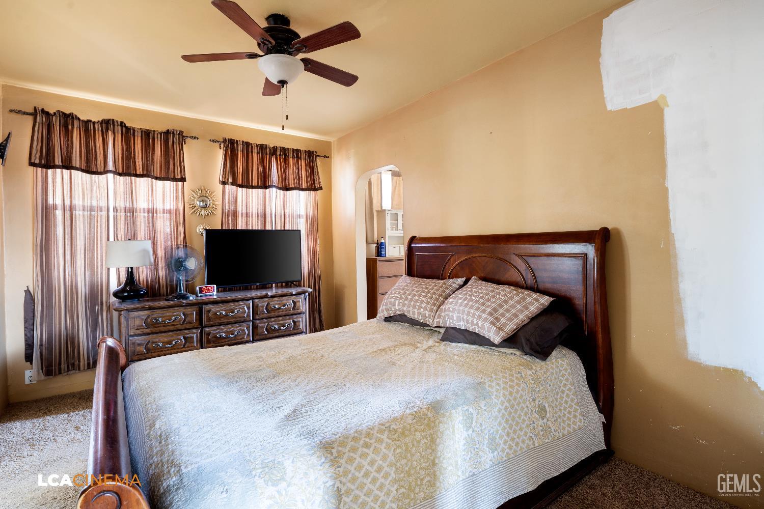 Undisclosed Address Bakersfield, CA 93308 - Photo 7 of 19 a bedroom with a bed and a flat screen tv