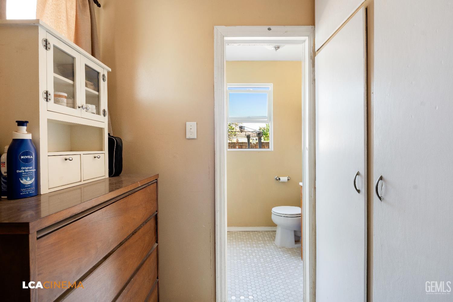 Undisclosed Address Bakersfield, CA 93308 - Photo 8 of 19 a bathroom with a toilet sink and a mirror