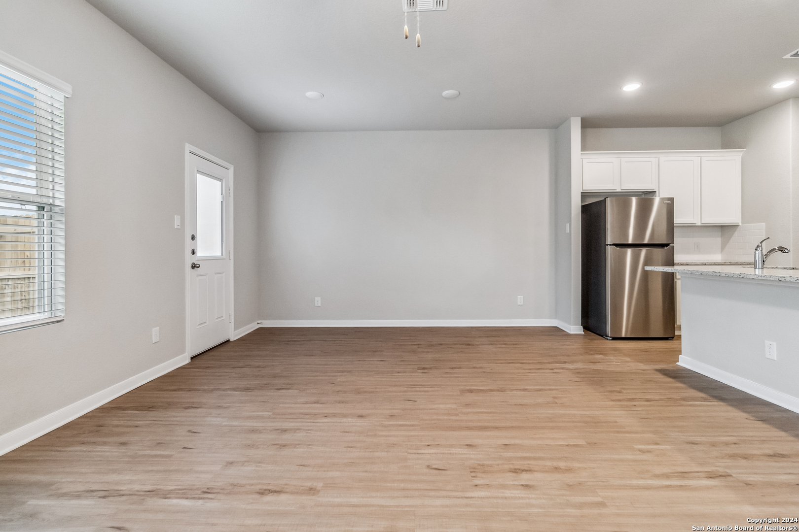 3928 Abbott Pass St. Hedwig, TX 78152 - Photo 15 of 35 a view of empty room with wooden floor