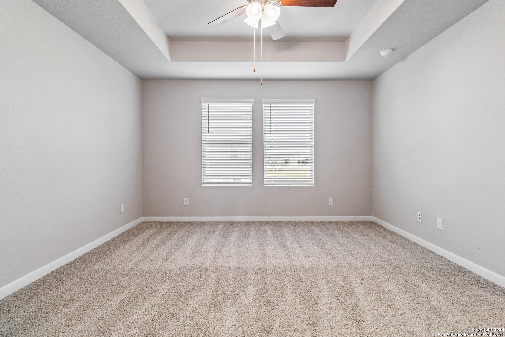 3928 Abbott Pass St. Hedwig, TX 78152 - Photo 24 of 35 an empty room with a window and a fan