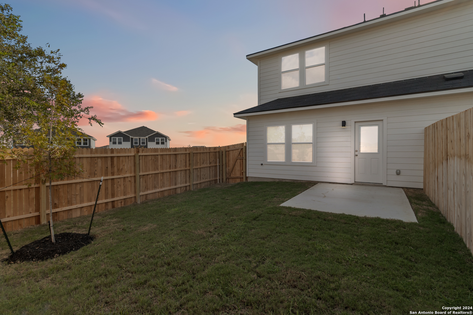 3928 Abbott Pass St. Hedwig, TX 78152 - Photo 32 of 35 a backyard of a house with lots of green space