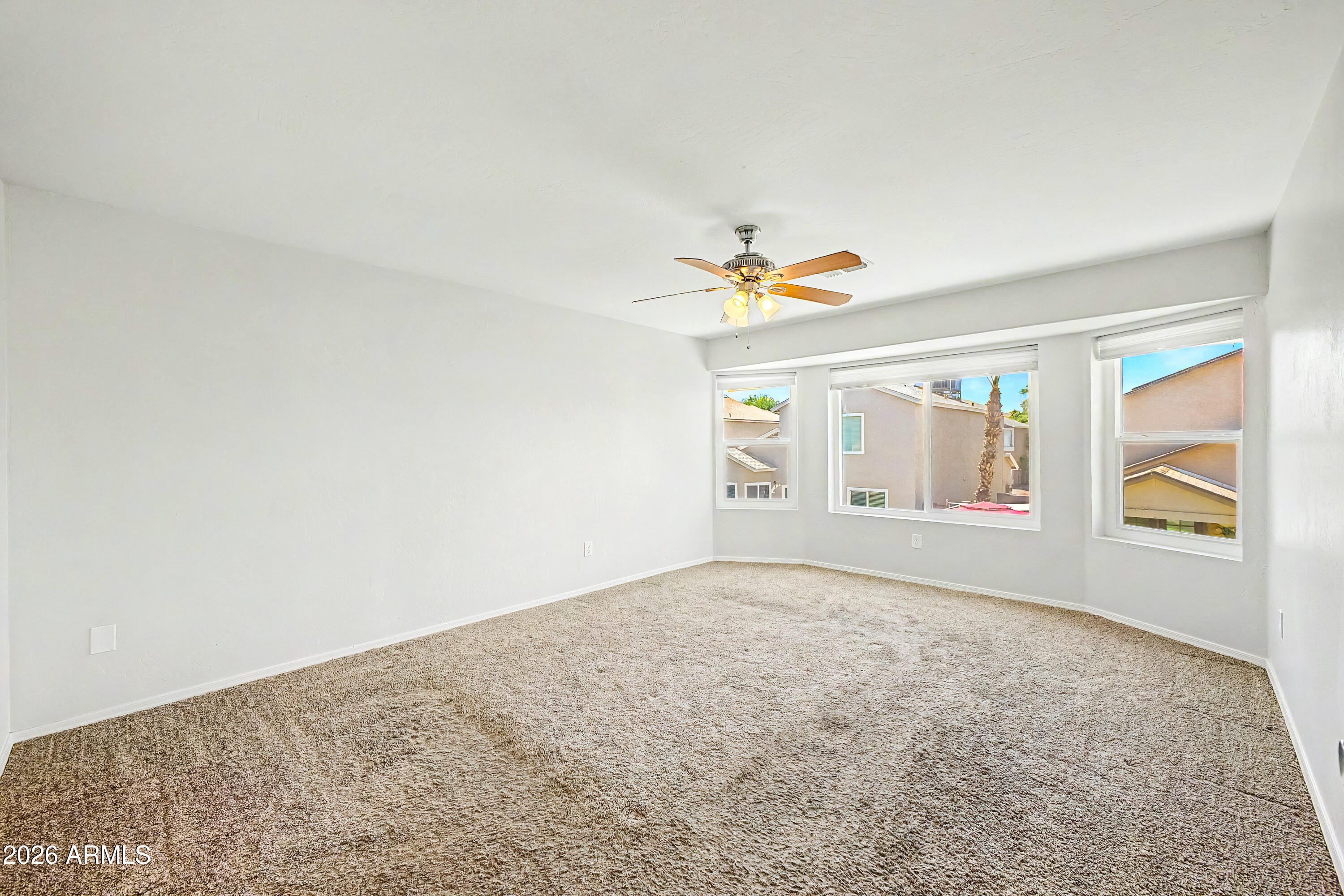 3134 East McKellips Road, Unit 221 Mesa, AZ 85213 - Photo 10 of 29 a view of an empty room with a window