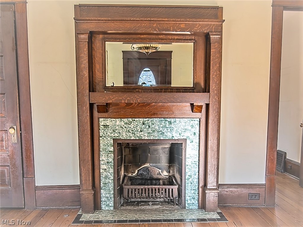 4041 Granger Road Akron, OH 44333 - Photo 4 of 34 Gas woodburning fireplace with tile surround and hearth in the Family room