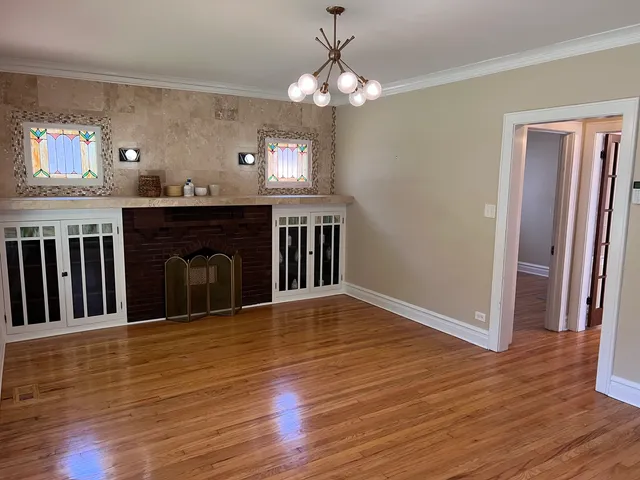 a view of livingroom with kitchen and fireplace