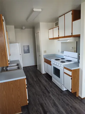 a kitchen with stainless steel appliances granite countertop a stove and a sink