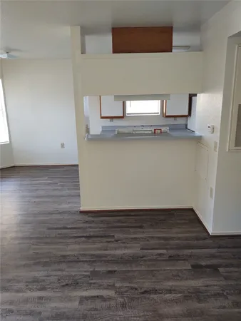a kitchen with stainless steel appliances granite countertop a sink and a stove