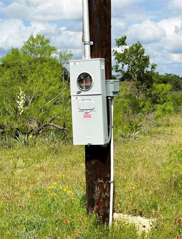 109 Comanche Hills Comanche, TX 76442 - Photo 6 of 25 a sign board with a small yard