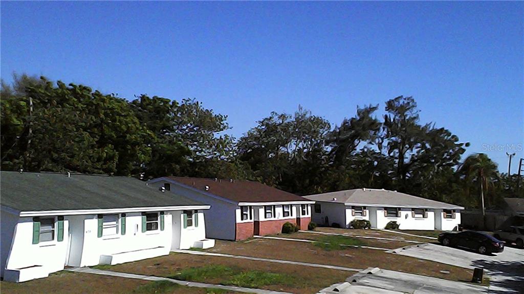 4136 Shoreline Drive New Port Richey, FL 34652 - Photo 1 of 1 a front view of a house with a yard