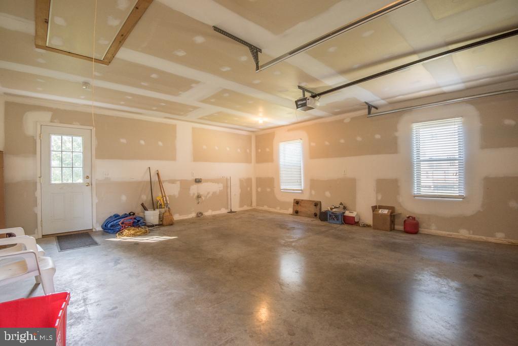 368 Koser Road Lititz, PA 17543 - Photo 38 of 43 Garage Bay 3 with Work Space & Storage Above