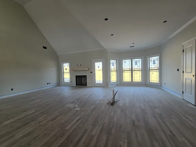 a room with a bed and window