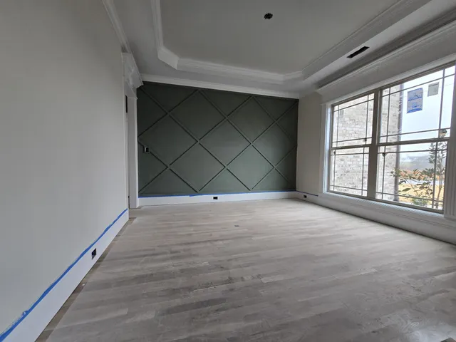 a view of empty room with a fireplace