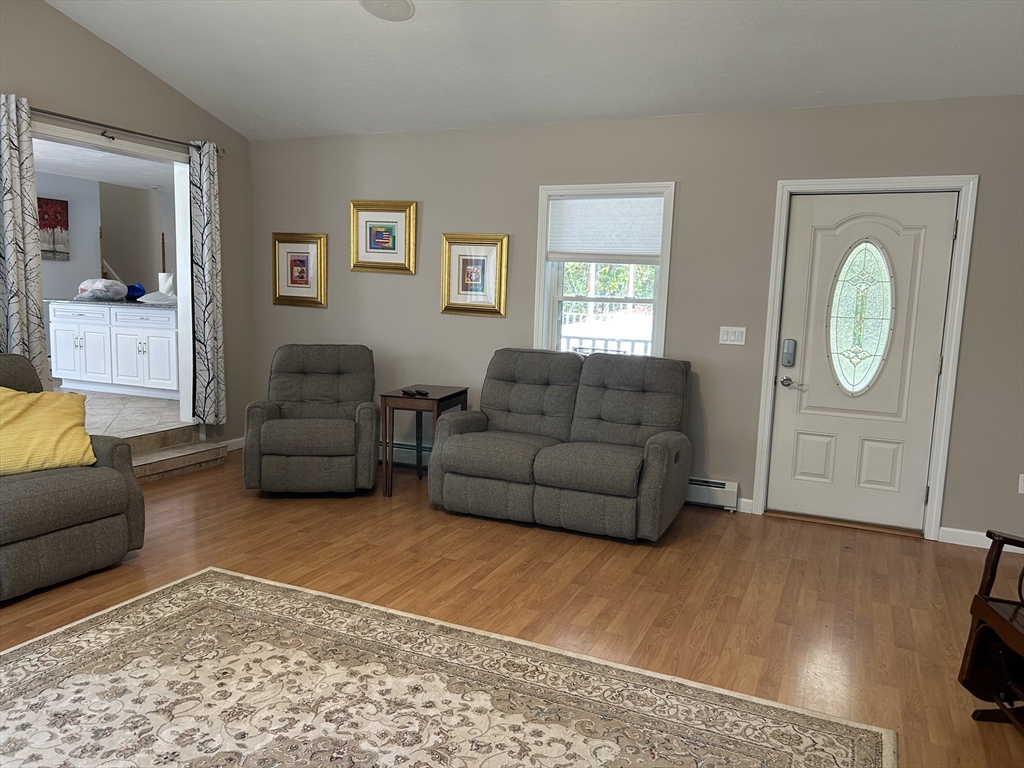 31 Bay Path Road Charlton, MA 01507 - Photo 19 of 42 a living room with furniture and a window