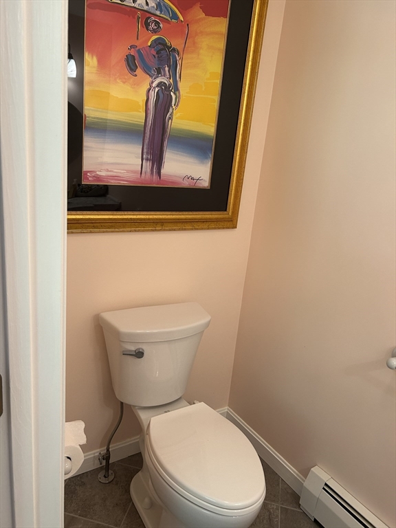 31 Bay Path Road Charlton, MA 01507 - Photo 20 of 42 a white toilet sitting next to a bathroom sink