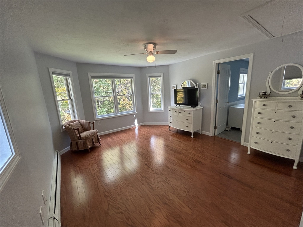 31 Bay Path Road Charlton, MA 01507 - Photo 21 of 42 a living room with furniture and a flat screen tv