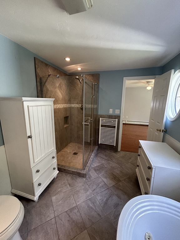 31 Bay Path Road Charlton, MA 01507 - Photo 25 of 42 a spacious bathroom with a mirror and a toilet