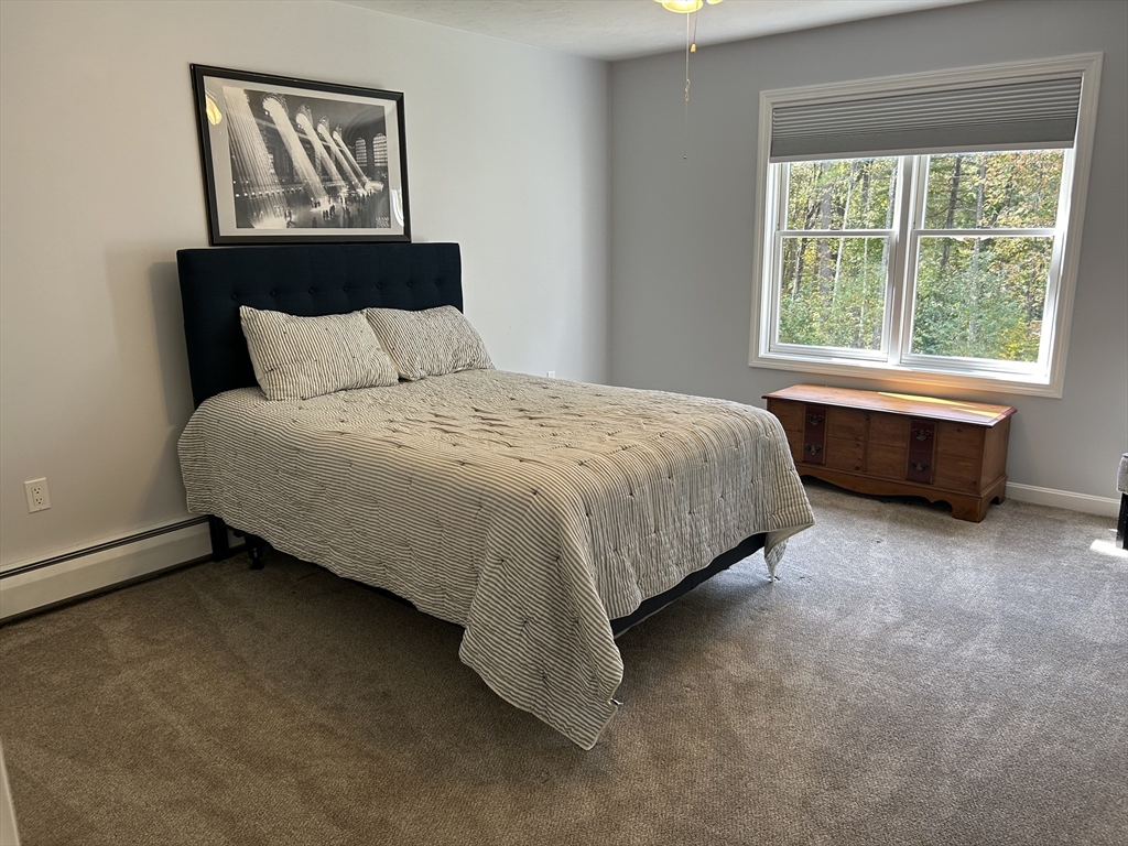 31 Bay Path Road Charlton, MA 01507 - Photo 27 of 42 a bed sitting in a bedroom next to a window