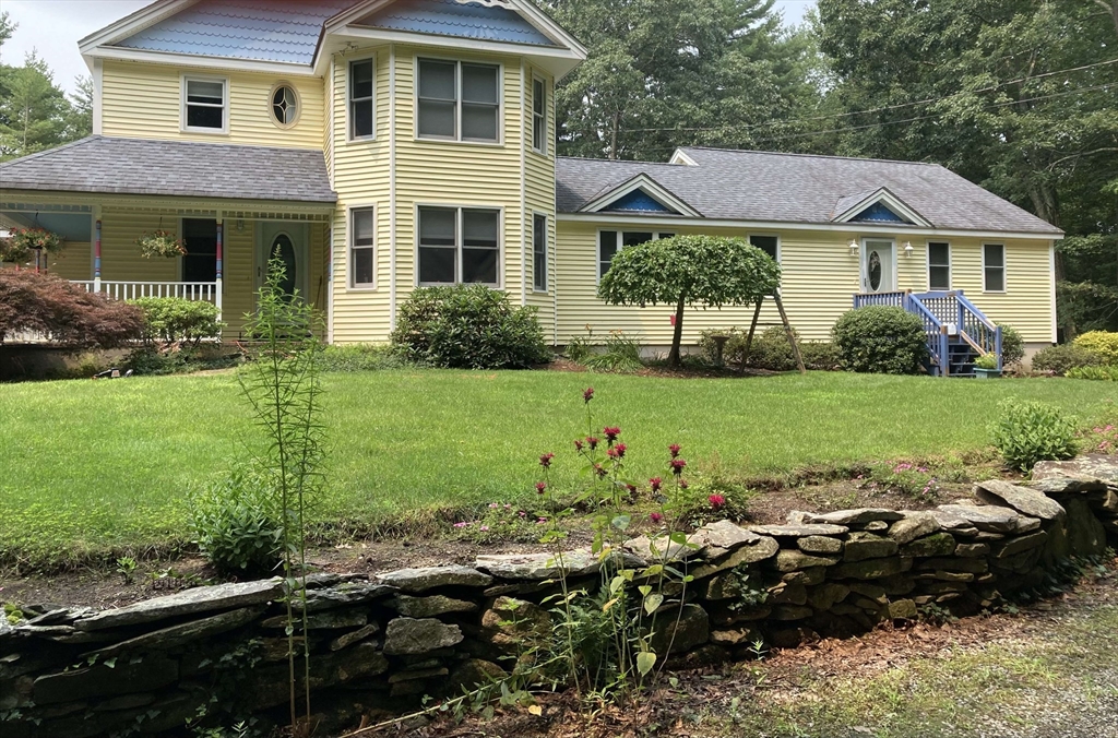 31 Bay Path Road Charlton, MA 01507 - Photo 3 of 42 a view of a house with a garden