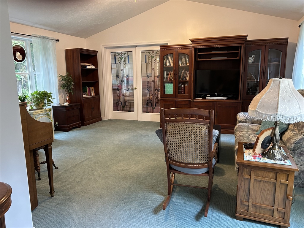 31 Bay Path Road Charlton, MA 01507 - Photo 33 of 42 a living room with furniture and a flat screen tv