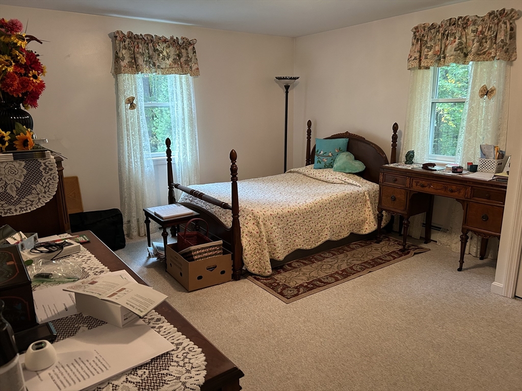 31 Bay Path Road Charlton, MA 01507 - Photo 35 of 42 a bedroom with a bed and wooden floor