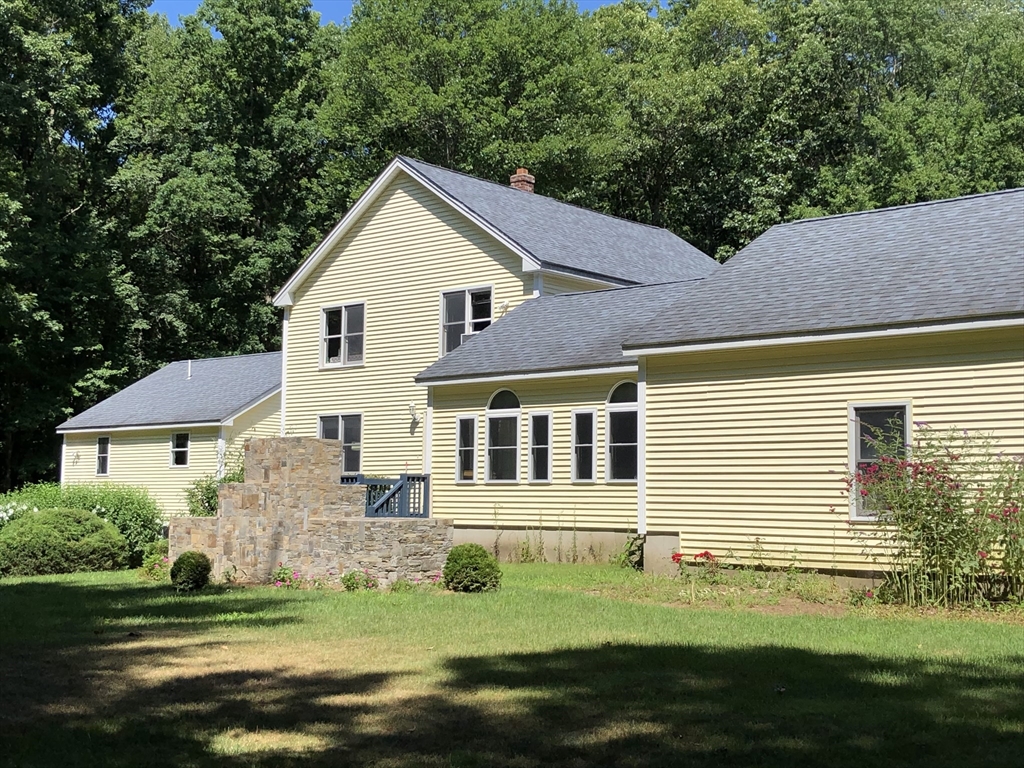 31 Bay Path Road Charlton, MA 01507 - Photo 8 of 42 a view of a house with a yard